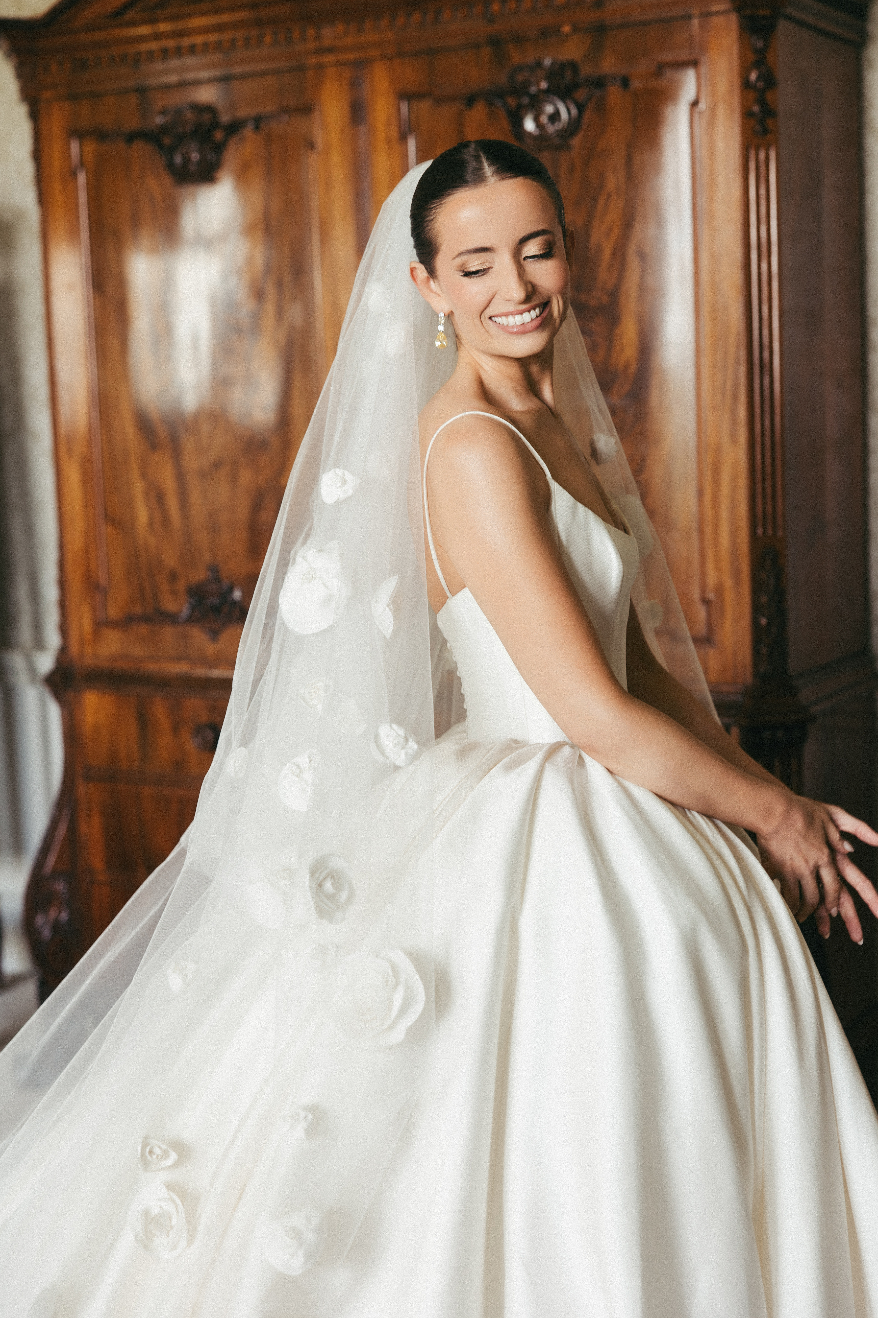 Bride in ballgown with floral veil