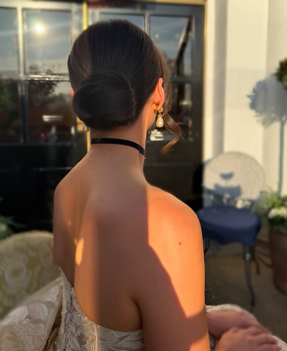 Bride with sleek low bun, golden light