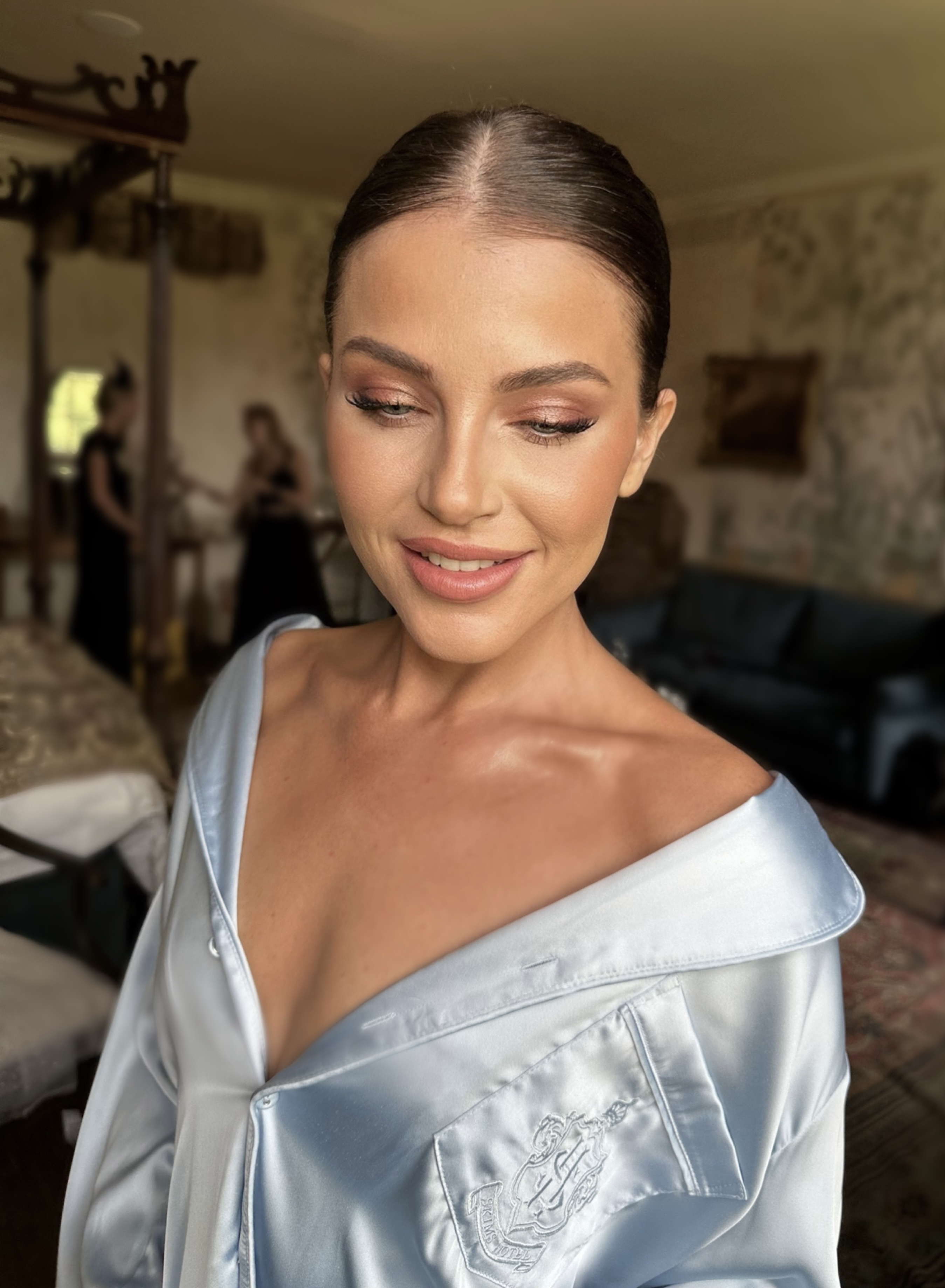 Bride with sleek bun and glam makeup
